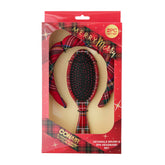 Diadema spa tartán de Conair mantiene el cabello recogido al lavar la cara.