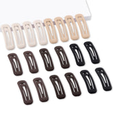 Barrettes rectangulares pequeñas de Cptots en negro mate, sujetan mechones finos con comodidad.