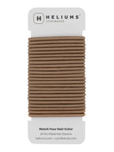 Gomas Cyndibands elásticas 4 mm en marrón claro para peinados discretos y cómodos.