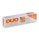 DUO adhesivo para pestañas tono oscuro en empaque, fijación duradera para aspecto diario