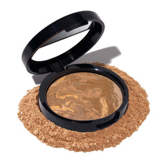 Laura Geller New York Balance-n-Brighten polvo Sand para un acabado natural.