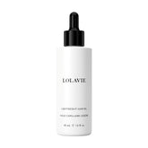 Bouteille LolaVie Huile Cheveux sur fond clair, brillance légère et sans poids.