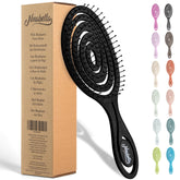 Cepillo Ninabella desenredante espiral con mango ergonómico para peinar sin tirones.