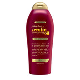OGX Champú Antifrizz con Keratina, botella frontal, controla el frizz y aporta brillo.