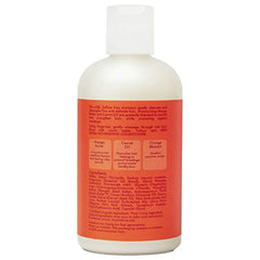 Aplicación en manos con SheaMoisture Mango Zanahoria, suavidad y desenredo.
