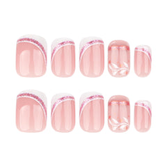 Uñas STBISEN pegables nude con punta francesa blanca y acabado lustroso.
