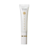 TATCHA Kissu Exfoliante Labial en envase claro; exfolia suavemente y prepara labios para hidratación.