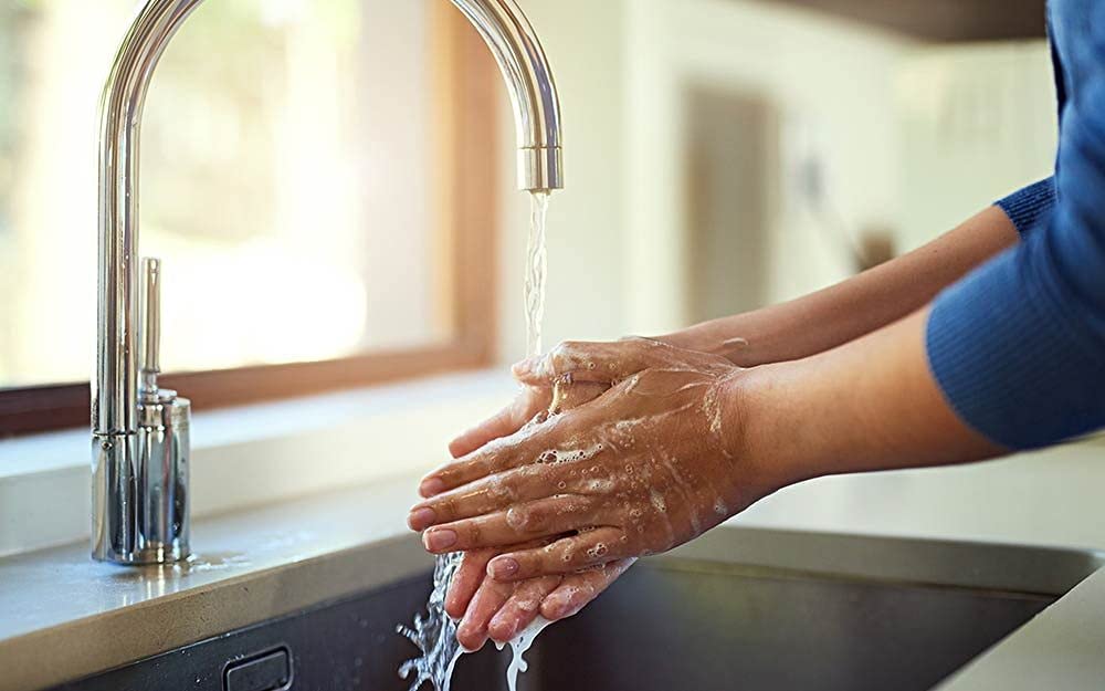 Pump dispenser demonstrating convenient kitchen sink hand washing.