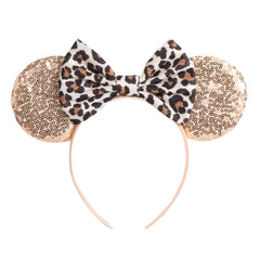 Diadema ASHONE orejas de ratón con lazo dorado, ideal para fiestas temáticas.
