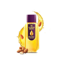 Bajaj Almond Drops: botella derramando aceite ligero para cabello suave
