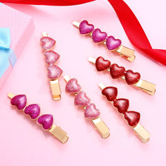 Pinza de pelo Boderier con corazón fucsia para un toque romántico.