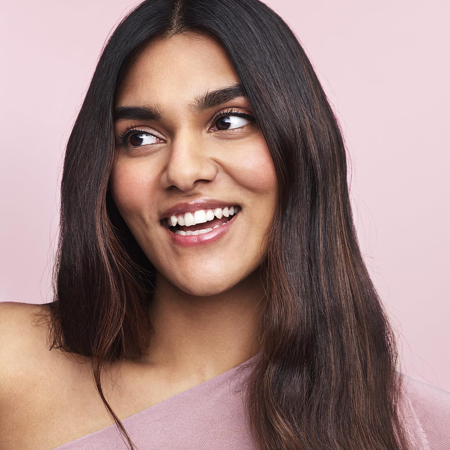 Cheveux lisses et soyeux après utilisation.