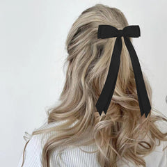 Canitor lazo cabello rosa, ideal para outfits juveniles y preppy.