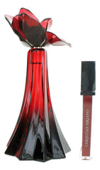 Ooh La Rouge Exclusif de Christian Siriano, brillo labial rojo, acabado brillante para completar el estilo.