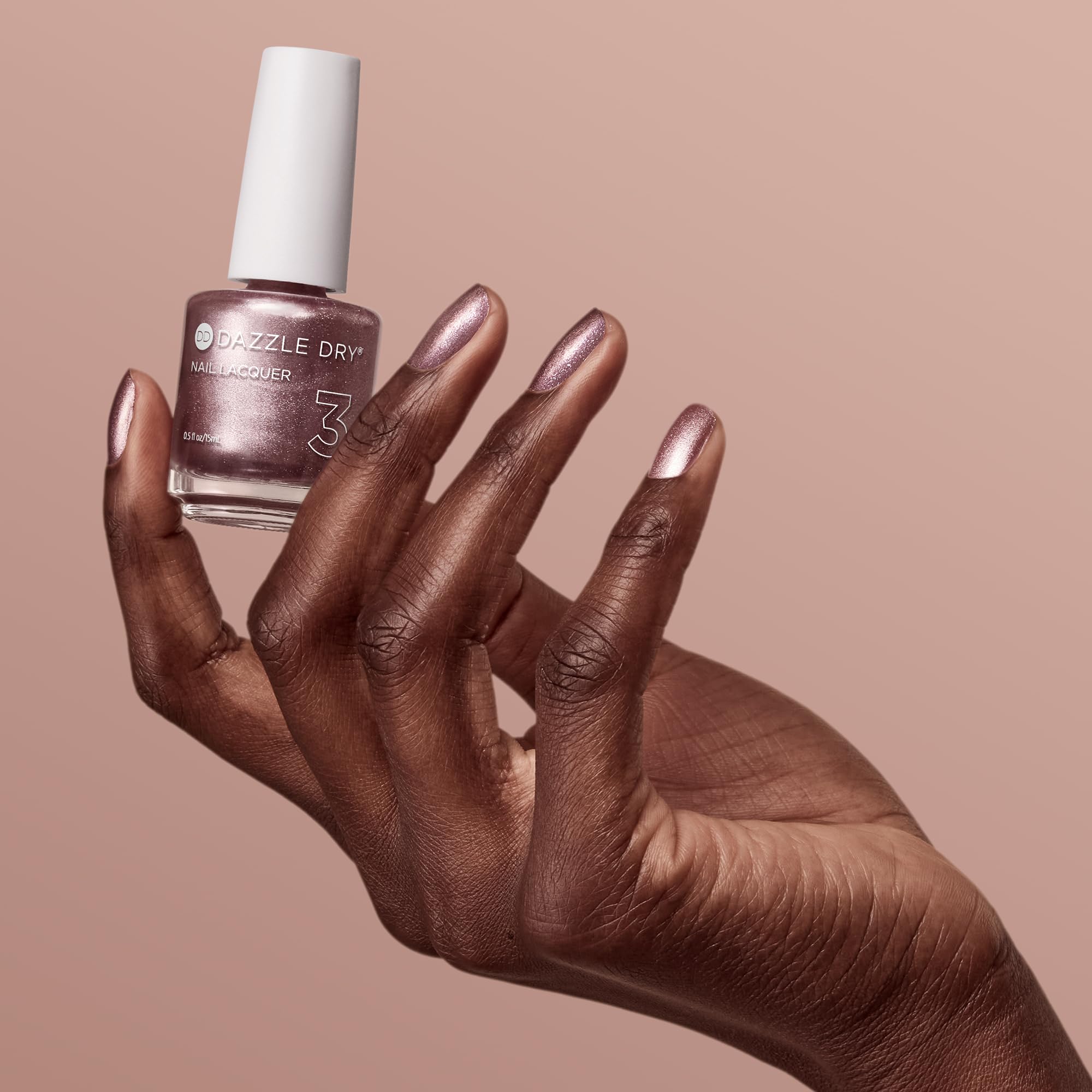 Dazzle Dry Out N' About rosa-oro metalico, secado sin lampara UV.