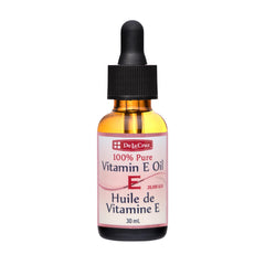 Aceite Vitamina E de De La Cruz para rostro, hidrata y suaviza la piel.