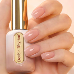 Double Rhythm bote redondo dorado, ideal para manicuras elegantes.