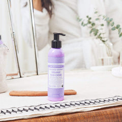 Dr. Bronner's crema capilar controla frizz sin pesadez