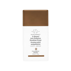 Drunk Elephant D-Bronzi Drops en envase, brillo natural para piel radiante.