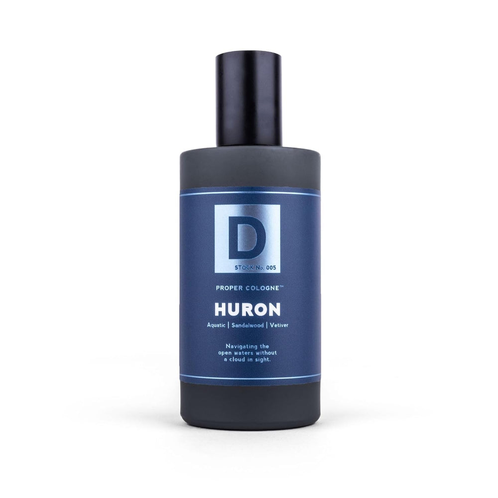 Duke Cannon Proper Cologne Huron cap closeup emphasizes premium fragrance oils.