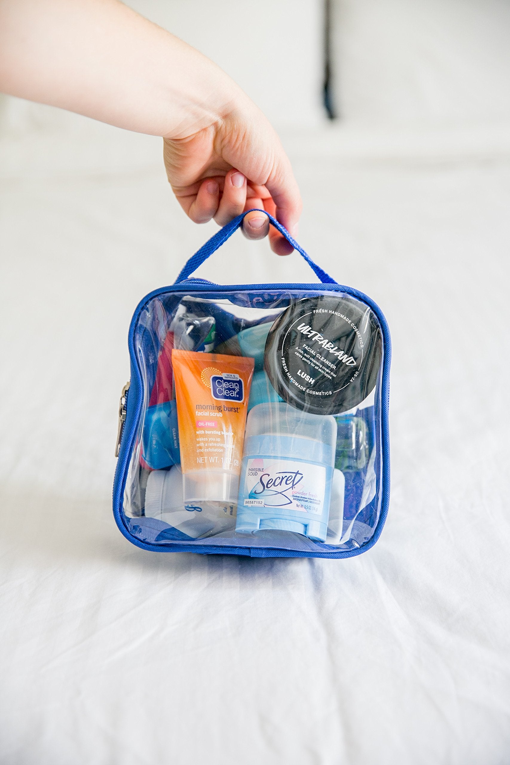 EzPacking royal blue clear bag fits carry-on essentials and keeps liquids visible.