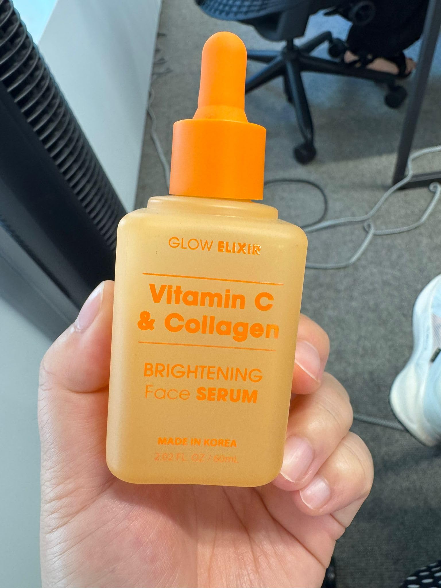 Dermatologist-tested seal on Glow Elixir clean beauty bottle