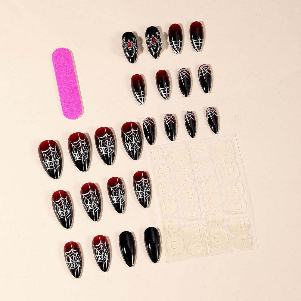 GRITOSE uñas Halloween con diseño de araña y cristales brillantes.
