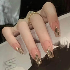 Uñas postizas Hkanlre con gradiente dorado para apariencia elegante.