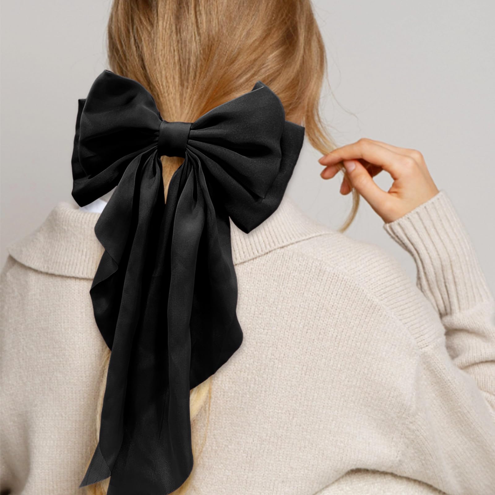 Lazo satén negro con cola larga illpta, ideal para peinados glamurosos.