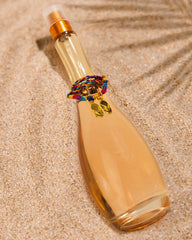 Botella de Jennifer Lopez Miami Glow con etiqueta visible, ideal para regalo o colección.