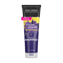 Champú Violet Crush de John Frieda en botella para neutralizar tonos amarillos.