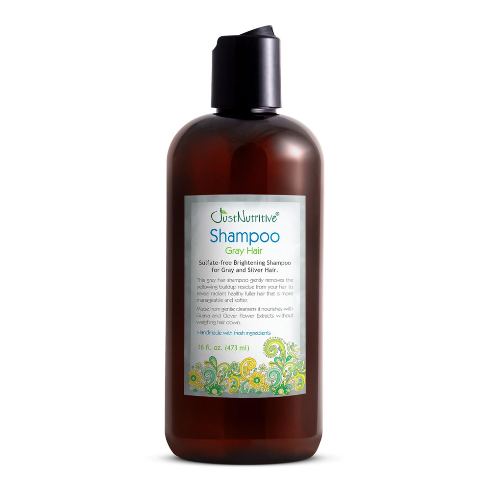 Just Nutritive shampoo gris para cabello, botella frontal, limpia y neutraliza tonos amarillentos en cabello gris.