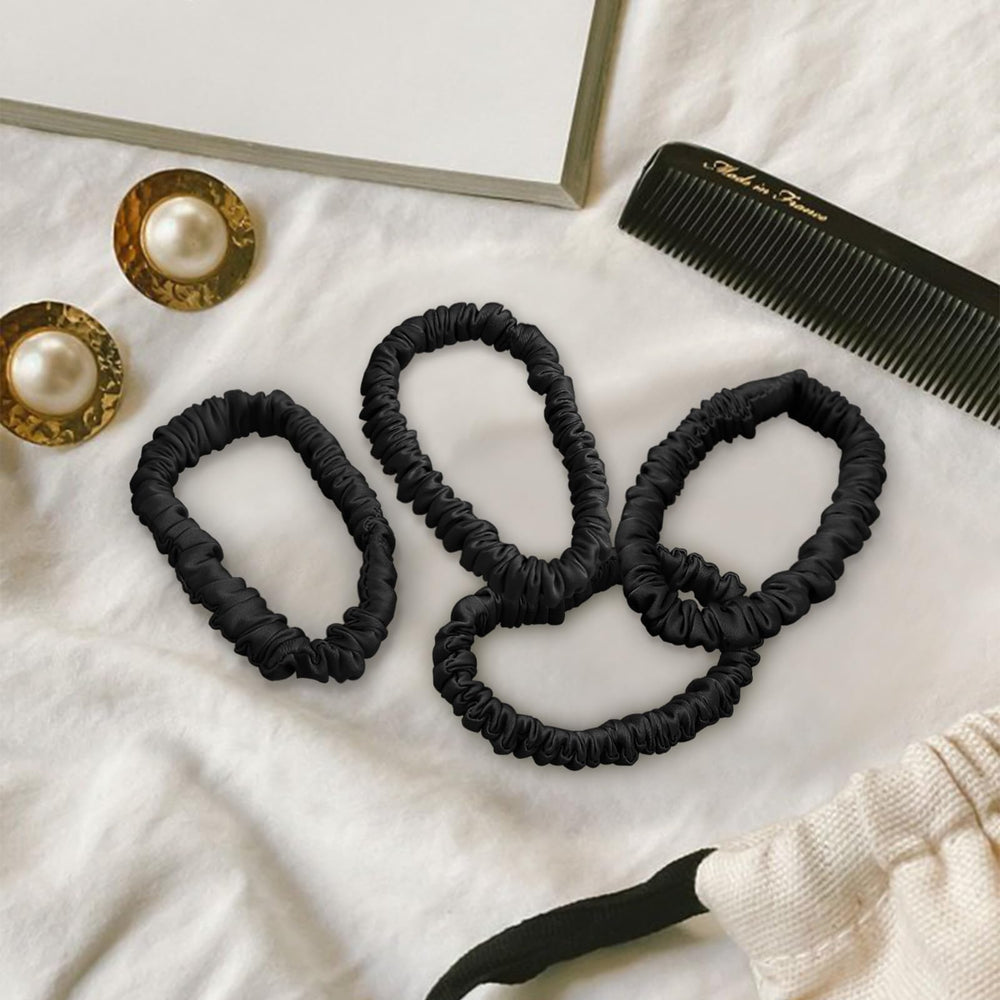 Kafteri ligas de seda de morera en la muñeca, accesorio elegante y práctico.