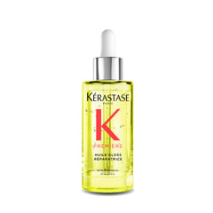 KÉRASTASE Première Aceite Reparador, botella para protección térmica y brillo duradero.
