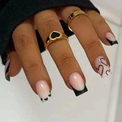 Maigitur uñas francesas negras con diseño de corazón blanco para un look rápido y duradero