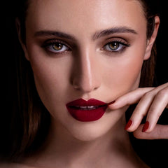 MAKI YIKA dark red lipstick on lips with matte, long-lasting finish