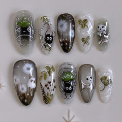 Uñas falsas MINGCHUN claras en almendra corta con diseño diente de león para elegancia diaria.