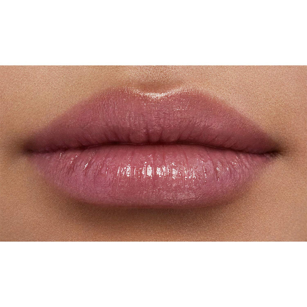 NARS Orgasm Afterglow Lip Balm con brillo dorado para luminosidad instantánea.