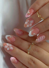 Uñas OCOUYVD con flor 3D y perlas para un look elegante.