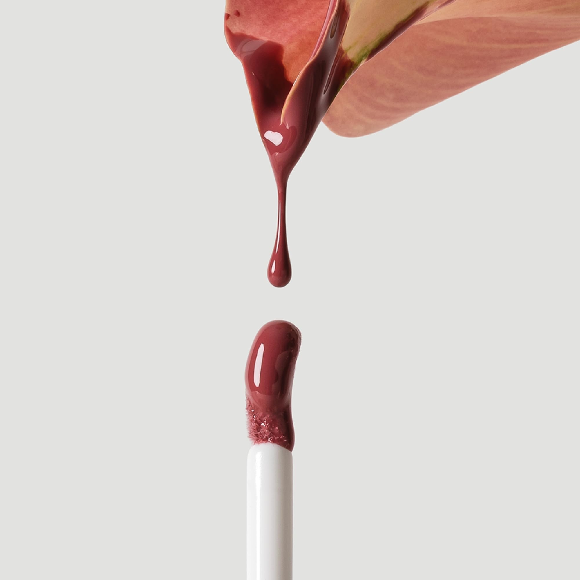 Ogee Beyond Clean Lip Gloss Anemone close‑up reveals dewy finish and luminous glow