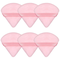 Esponja Pimoys para polvo con diseño triangular rosa, ideal para base y contorno.