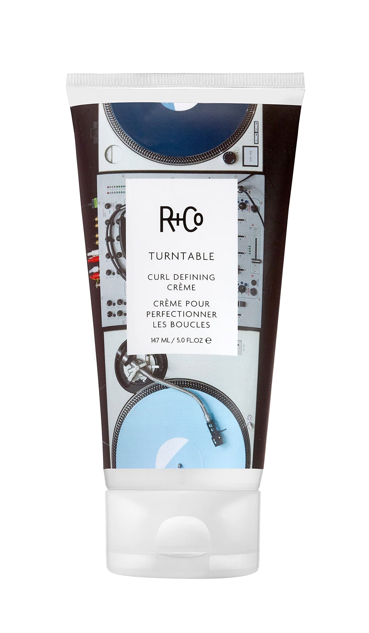 R+Co Turntable crema definidora de rizos en botella para brillo y definición.