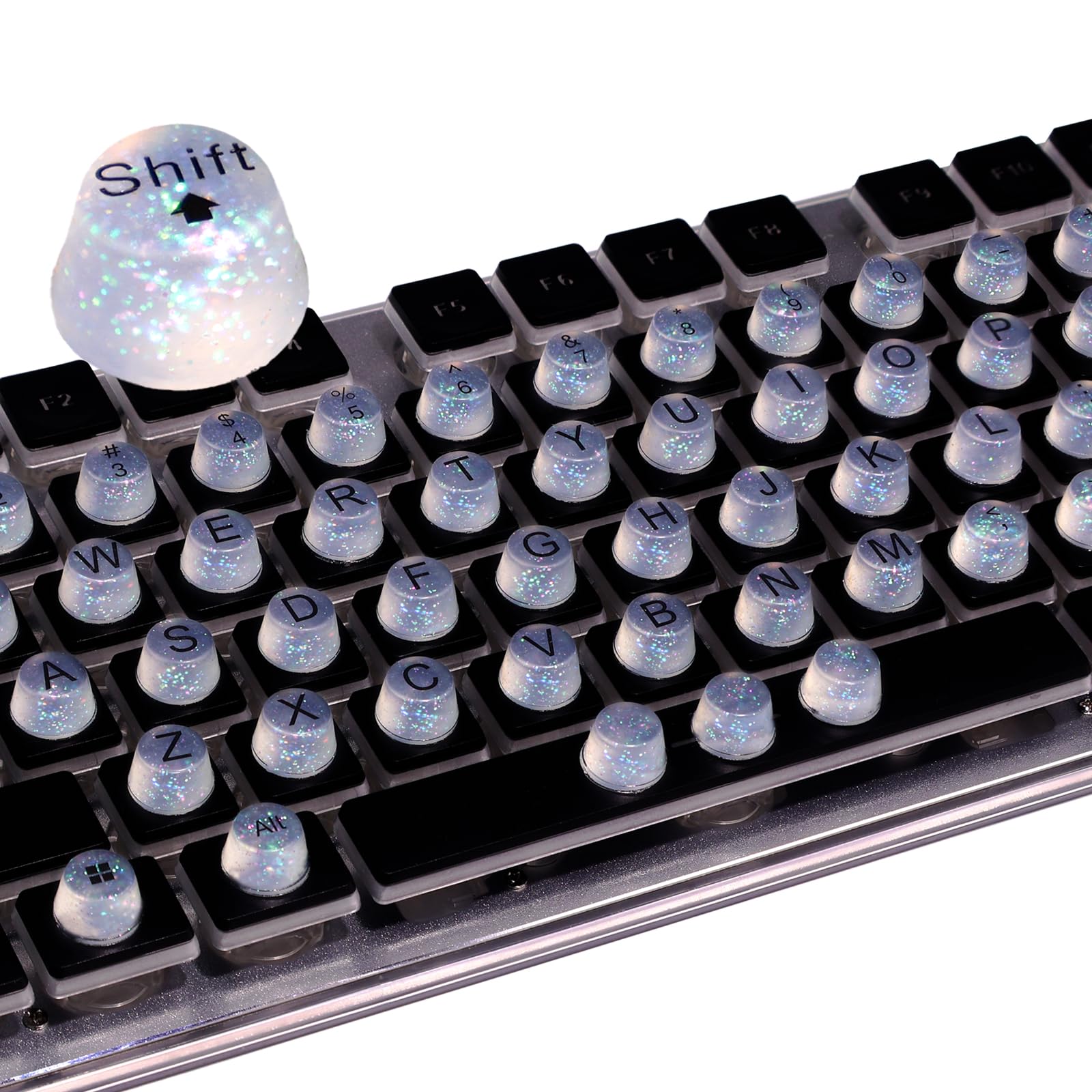 Raised Button: teclas elevadas para uñas largas, mejora precisión y comodidad al teclear.