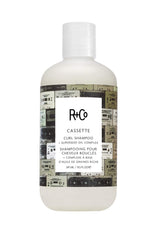 R+Co CASSETTE champú para rizos: botella visible para definición y limpieza suave.