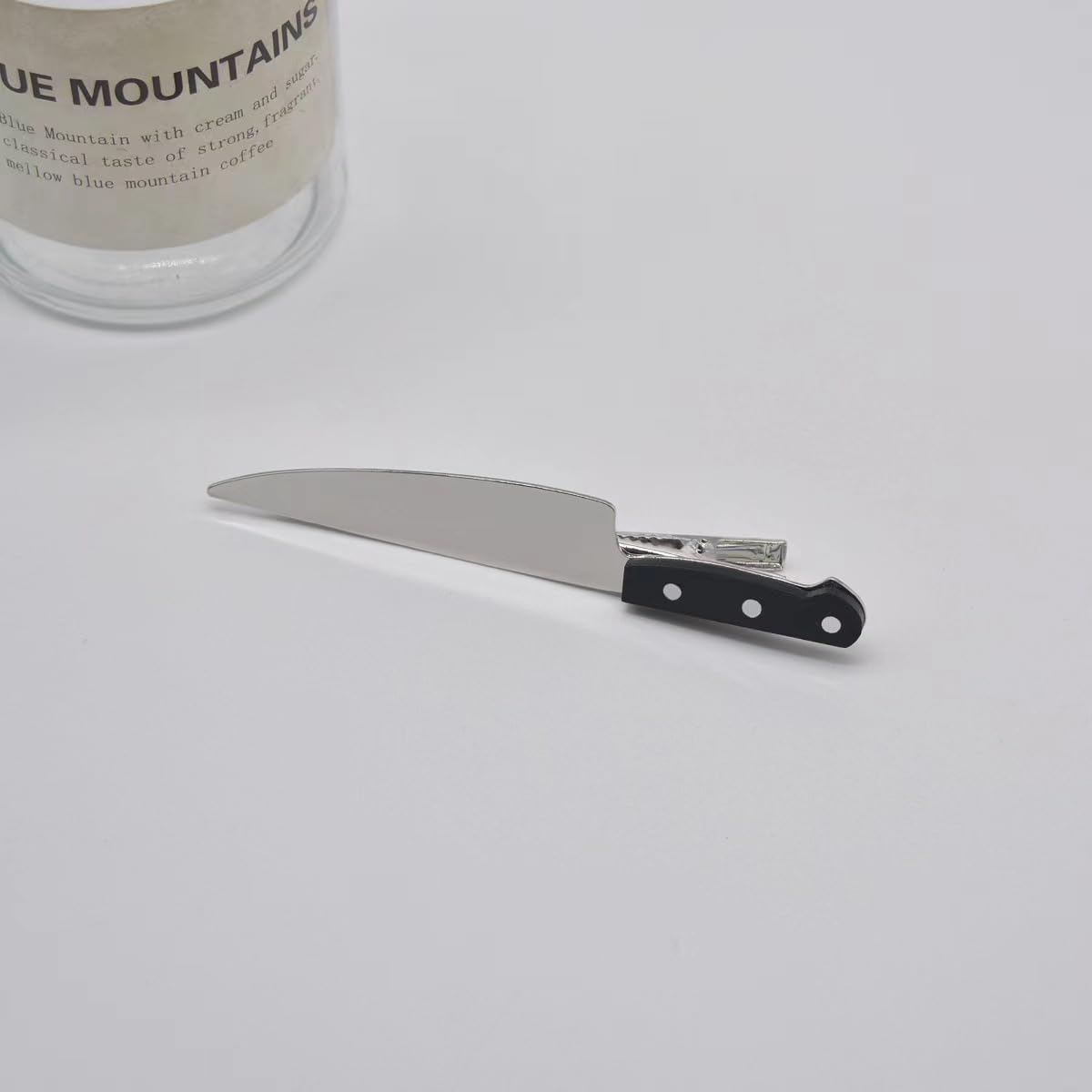 Clips de cuchillo para cabello, estilo Halloween con acabado metálico resistente.