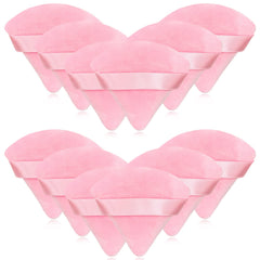Puf triangular rosa Scartink de terciopelo para polvo suelto, acabado suave.