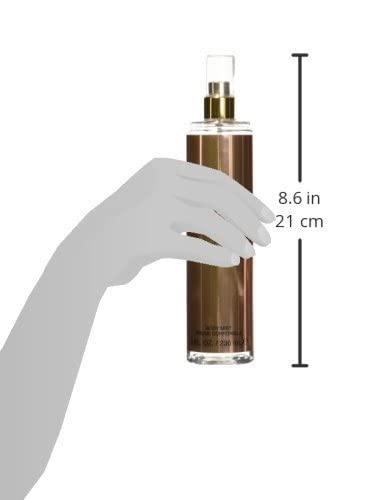 Applying Sean John Unforgivable body mist for even fragrance application.