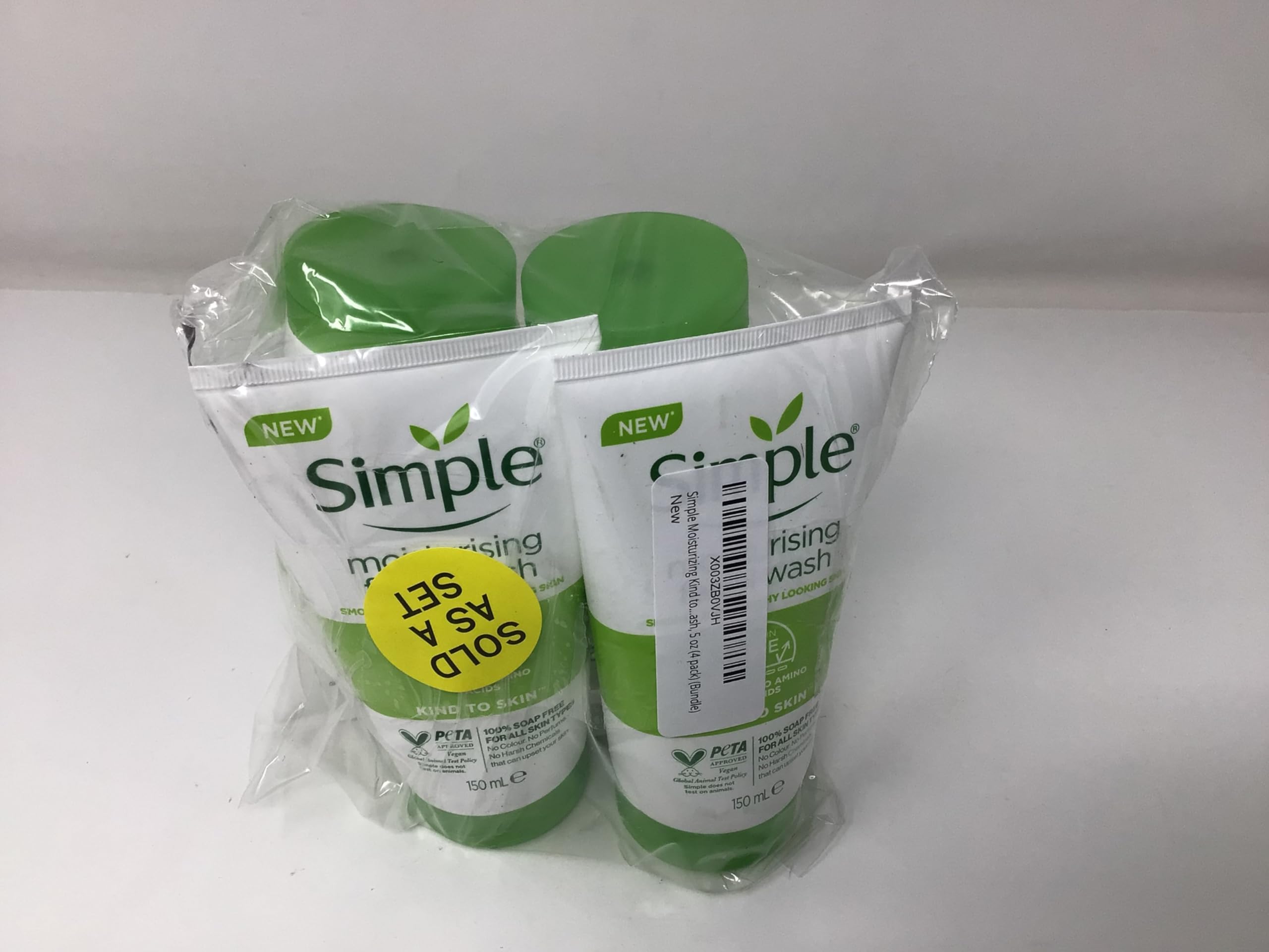 Simple Moisturizing Face Wash bottle pour action, easy dispensing for quick cleanse.