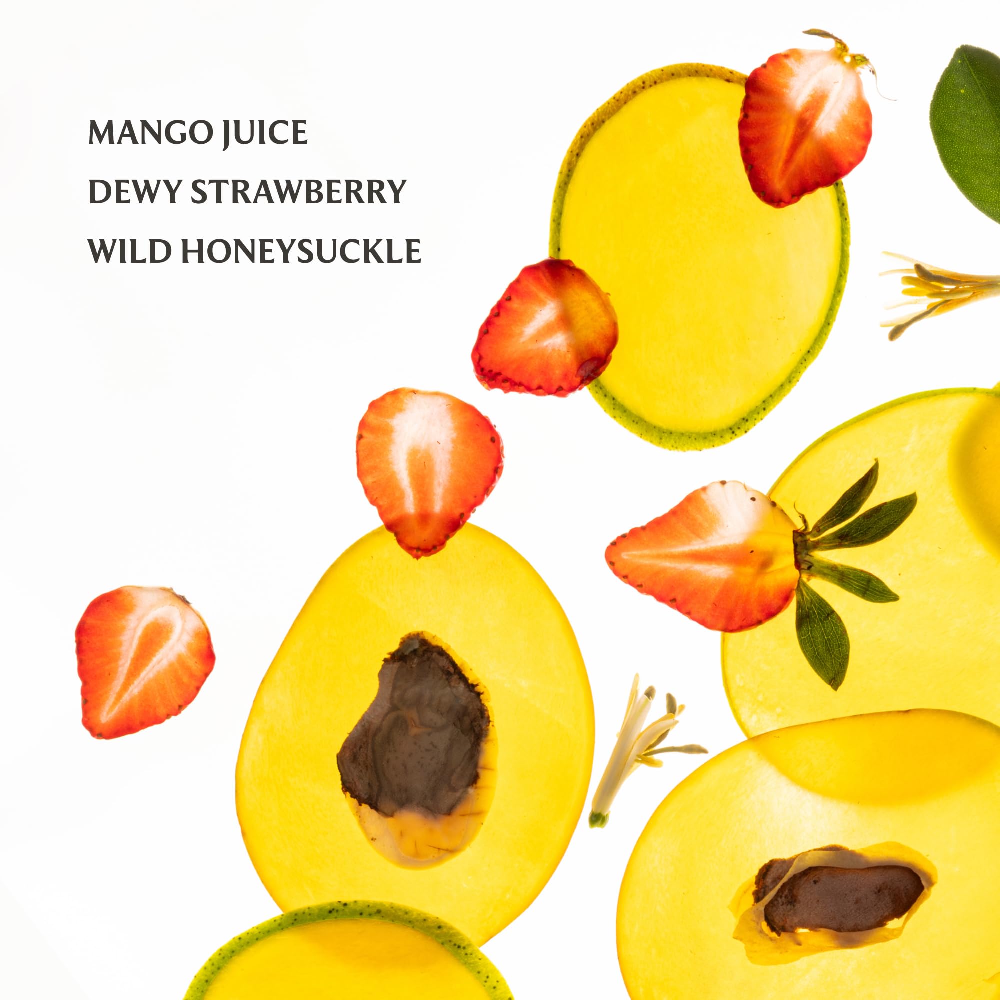 Touchland Mango Mojo mist applied to hair for refreshing scent