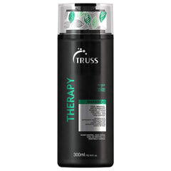 TRUSS Therapy anticaspa champú en botella, combate la caspa y deja sensación de frescura.